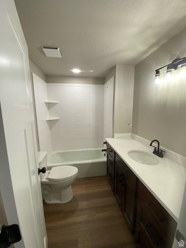 525 S 75 W, Providence, UT 84332 - bathroom with toilet, a textured ceiling, wood finished floors, shower / bath combination, and vanity
