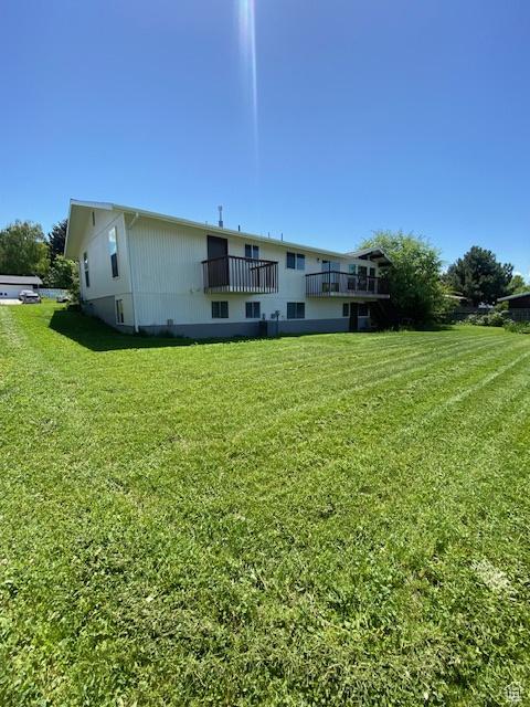 525 S 75 W, Providence, UT 84332 - rear view of property with a lawn