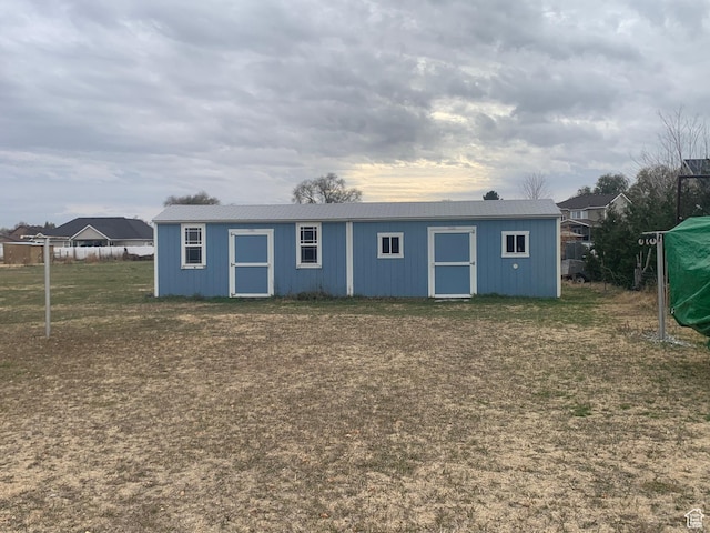 back of house featuring a yard