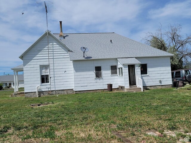 5949 W 5700 S, Hooper, UT 84315 - back of property with roof with shingles, entry steps, and a lawn
