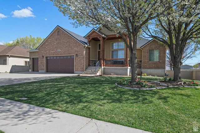 955 W 720 N, Tremonton, UT 84337 - view of front facade featuring concrete driveway, brick siding, a front yard, and a garage