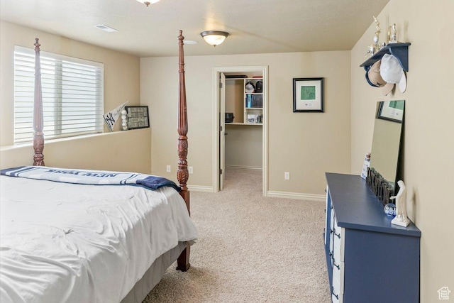 955 W 720 N, Tremonton, UT 84337 - bedroom featuring a walk in closet, light carpet, visible vents, and baseboards