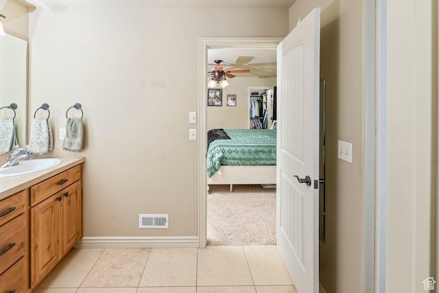 955 W 720 N, Tremonton, UT 84337 - bathroom with tile patterned floors, baseboards, visible vents, ceiling fan, and vanity
