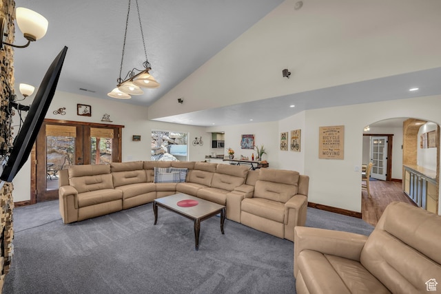 1060 E Summit Ridge Dr, St George, UT 84790 - carpeted living room with visible vents, high vaulted ceiling, french doors, arched walkways, and baseboards