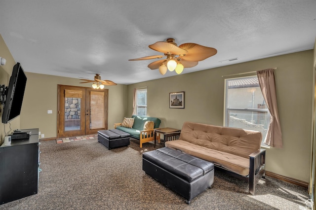 1060 E Summit Ridge Dr, St George, UT 84790 - living room with visible vents, a ceiling fan, french doors, carpet, and baseboards