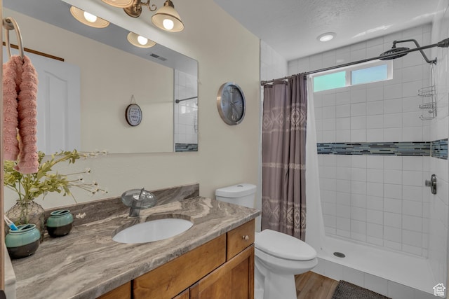 1060 E Summit Ridge Dr, St George, UT 84790 - bathroom with vanity, toilet, visible vents, and a stall shower