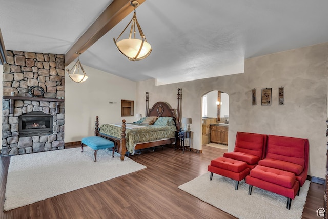 1060 E Summit Ridge Dr, St George, UT 84790 - bedroom with lofted ceiling with beams, baseboards, arched walkways, and wood finished floors