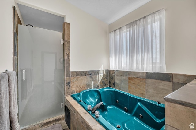 1060 E Summit Ridge Dr, St George, UT 84790 - bathroom with a tub with jets and a stall shower