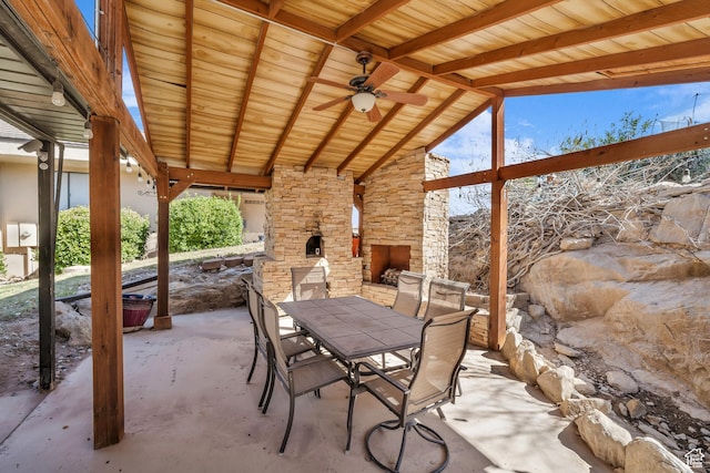 1060 E Summit Ridge Dr, St George, UT 84790 - view of patio / terrace with outdoor dining space and an outdoor stone fireplace