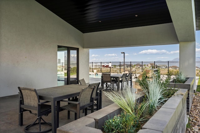 4823 W Mossley Dr, Herriman, UT 84096 - view of patio / terrace with outdoor dining space and fence