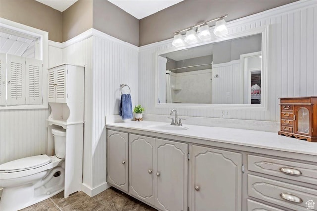 full bathroom featuring vanity and toilet