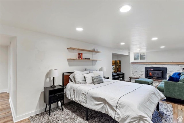 bedroom featuring recessed lighting, baseboards, and wood finished floors