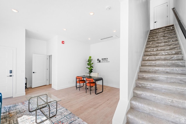 4386 S 900 E Unit 102, Millcreek, UT 84124 - staircase featuring wood finished floors, recessed lighting, and baseboards