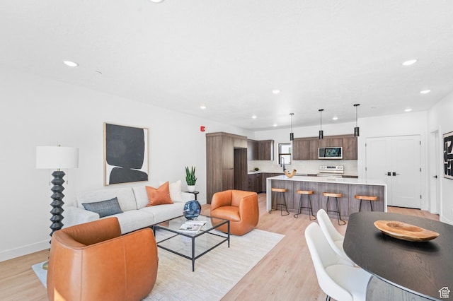 4386 S 900 E Unit 102, Millcreek, UT 84124 - living room with recessed lighting, light wood-type flooring, and baseboards