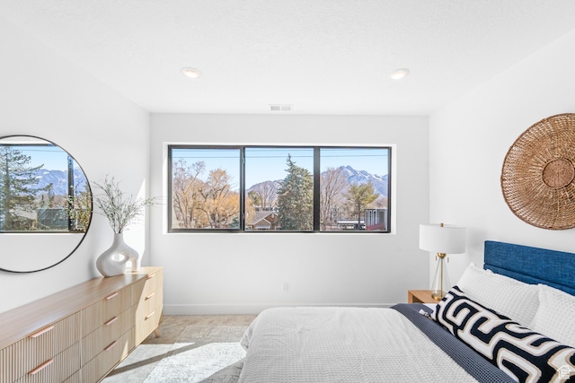 4386 S 900 E Unit 102, Millcreek, UT 84124 - bedroom featuring multiple windows, recessed lighting, and baseboards