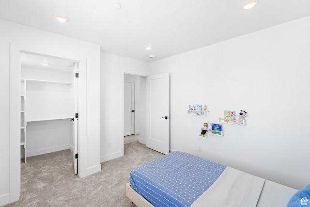 4386 S 900 E Unit 102, Millcreek, UT 84124 - carpeted bedroom with a walk in closet, recessed lighting, and baseboards