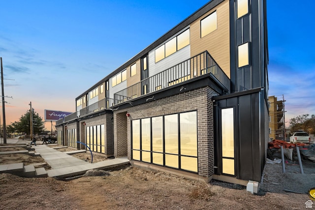4386 S 900 E Unit 102, Millcreek, UT 84124 - back of house with a balcony and brick siding