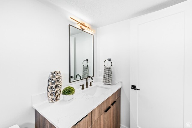 4386 S 900 E Unit 101, Millcreek, UT 84124 - bathroom with a textured ceiling and vanity