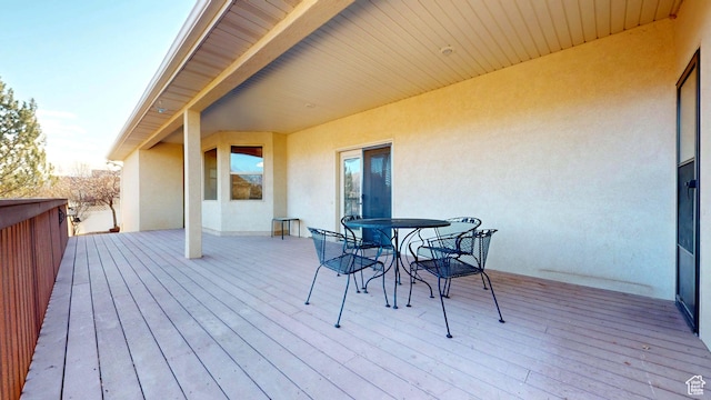 deck with outdoor dining area