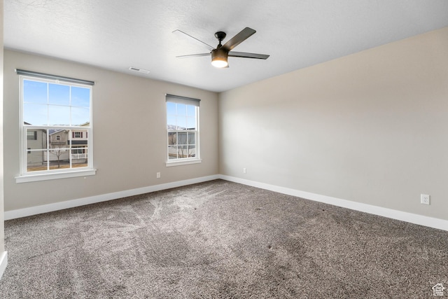 1848 E American Way Unit 2, Eagle Mountain, UT 84005 - spare room featuring a ceiling fan, carpet floors, and baseboards