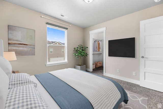 1848 E American Way Unit 2, Eagle Mountain, UT 84005 - bedroom featuring baseboards and a spacious closet