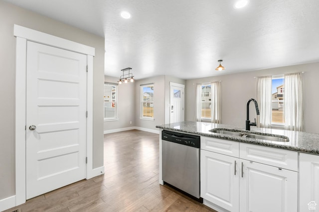 1848 E American Way Unit 2, Eagle Mountain, UT 84005 - kitchen with stainless steel dishwasher, a sink, plenty of natural light, white cabinetry, and recessed lighting