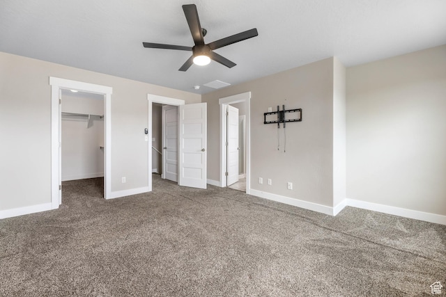 1848 E American Way Unit 2, Eagle Mountain, UT 84005 - unfurnished bedroom with carpet, baseboards, a spacious closet, and ceiling fan