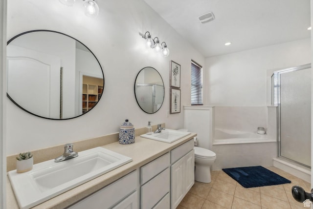 bathroom with tile patterned flooring, a shower stall, double vanity, and a sink
