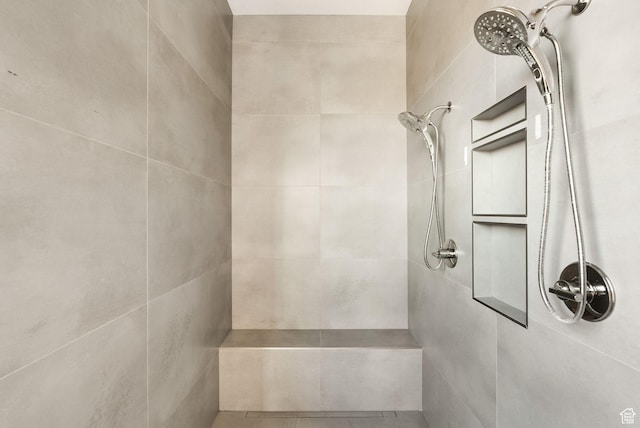 full bathroom with a tile shower