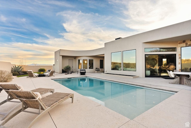 view of pool featuring a fenced in pool and a patio