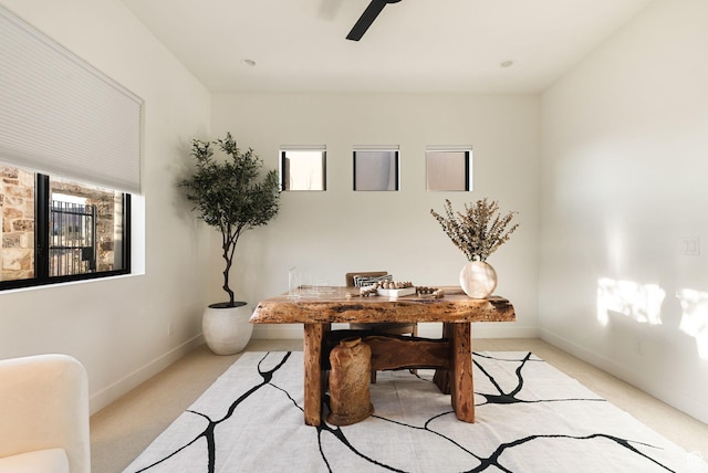 home office with light colored carpet, baseboards, and ceiling fan