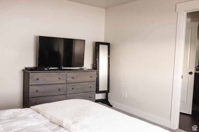 bedroom featuring baseboards