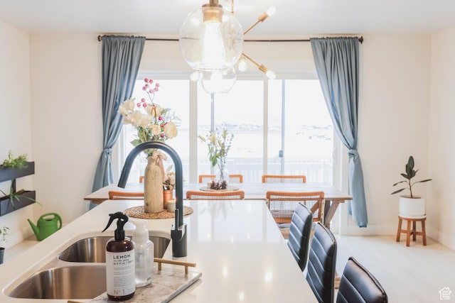 interior details with a sink and light countertops