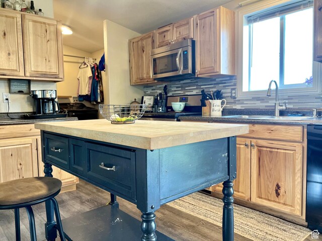 1568 N 750 E, Vernal, UT 84078 - kitchen featuring light wood finished floors, light brown cabinetry, butcher block counters, decorative backsplash, and appliances with stainless steel finishes