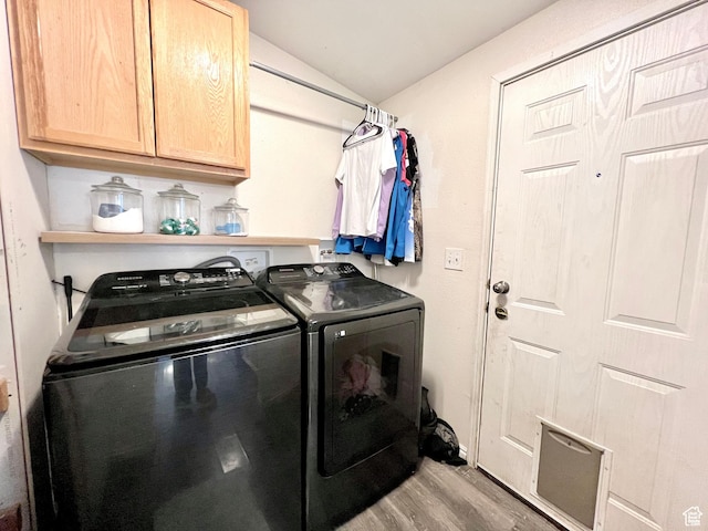 1568 N 750 E, Vernal, UT 84078 - clothes washing area with cabinet space, wood finished floors, and washer and clothes dryer