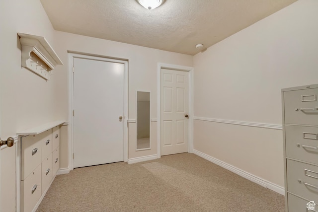 92 W Centerville Commons Way, Centerville, UT 84014 - unfurnished bedroom with light colored carpet, baseboards, and a textured ceiling
