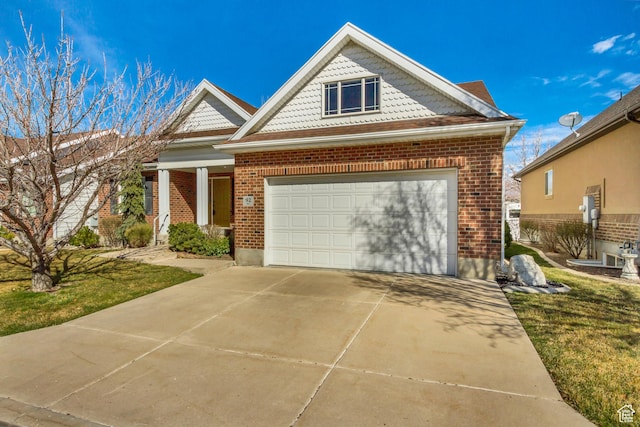 92 W Centerville Commons Way, Centerville, UT 84014 - view of front of house with brick siding, an attached garage, and concrete driveway