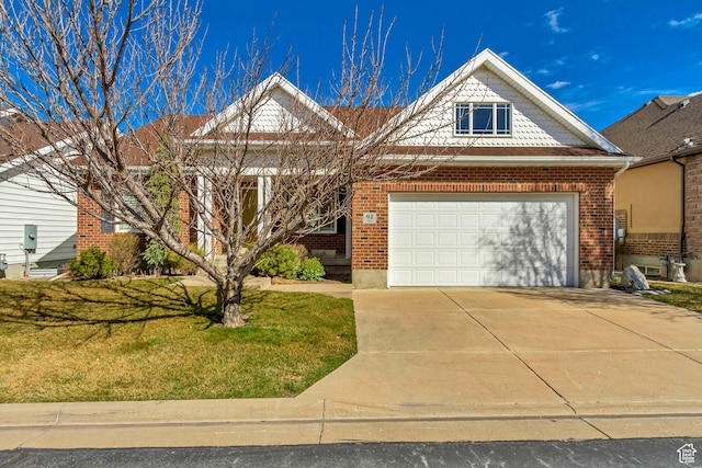 92 W Centerville Commons Way, Centerville, UT 84014 - view of front of house with brick siding, concrete driveway, a garage, and a front yard