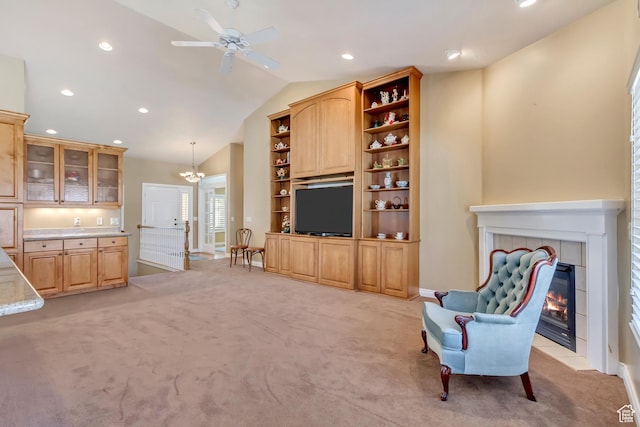 92 W Centerville Commons Way, Centerville, UT 84014 - living room with light colored carpet, lofted ceiling, recessed lighting, ceiling fan with notable chandelier, and a fireplace