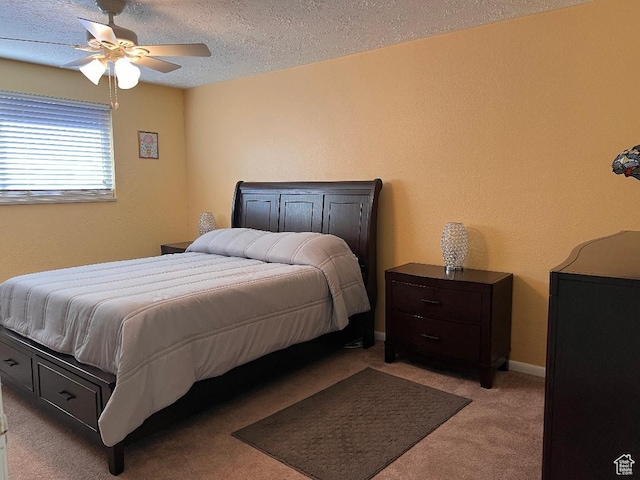 1333 S Lorl Ln E Unit 6, Ogden, UT 84404 - bedroom with baseboards, light carpet, a textured ceiling, and a ceiling fan