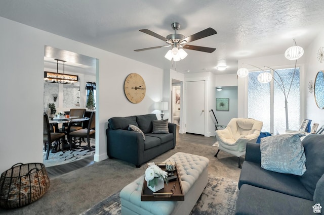 1333 S Lorl Ln E Unit 6, Ogden, UT 84404 - living area featuring a textured ceiling and a ceiling fan