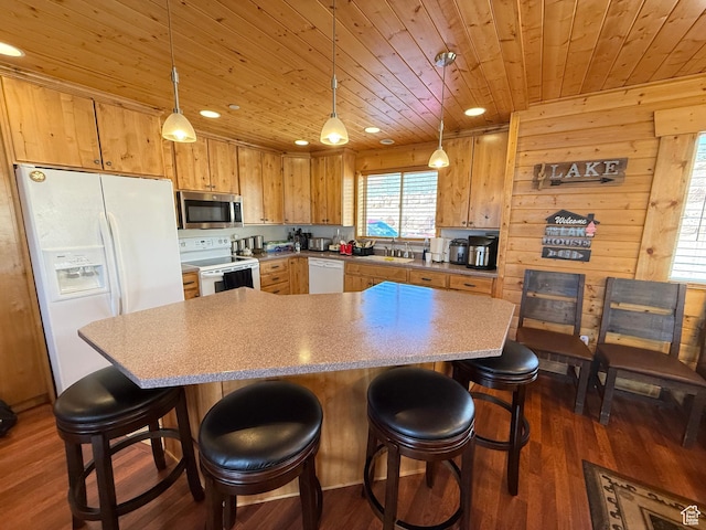 8043 E Badger Dr N, Heber City, UT 84032 - kitchen with white appliances, wood ceiling, dark wood finished floors, a breakfast bar, and light countertops