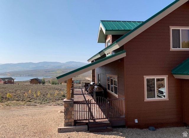 8043 E Badger Dr N, Heber City, UT 84032 - view of home's exterior with metal roof and a water and mountain view