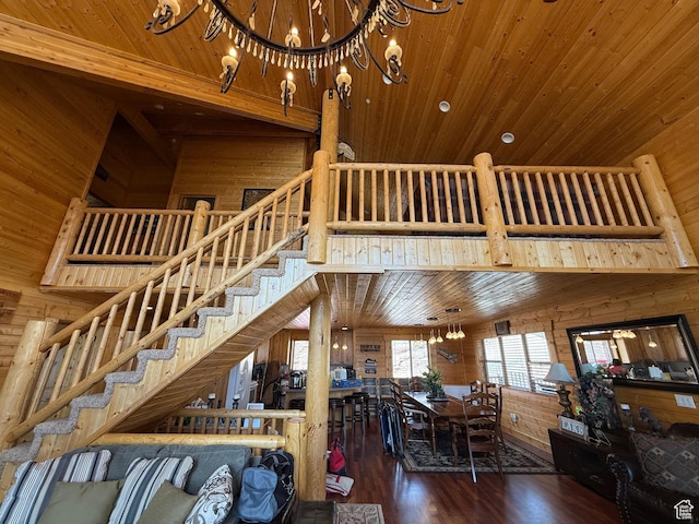 8043 E Badger Dr N, Heber City, UT 84032 - living area featuring a chandelier, a towering ceiling, wood walls, wooden ceiling, and stairs