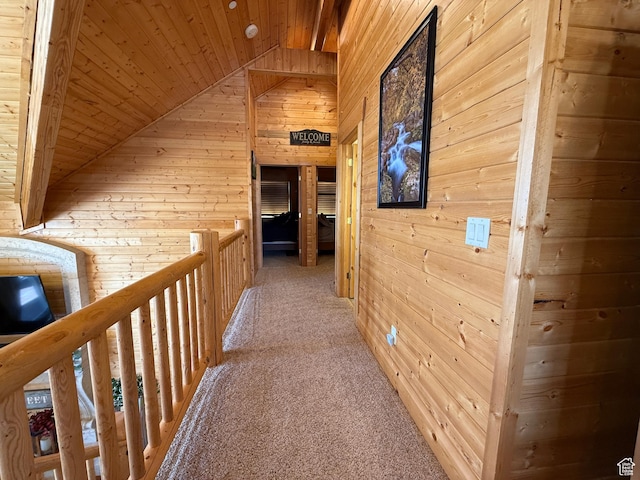 8043 E Badger Dr N, Heber City, UT 84032 - hall with wooden walls, wood ceiling, vaulted ceiling, light colored carpet, and an upstairs landing