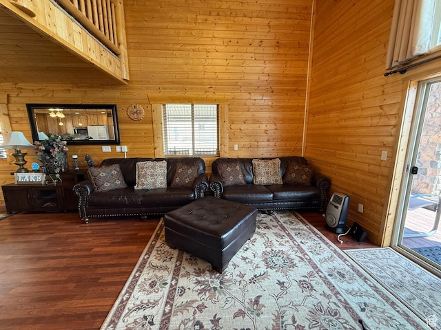 8043 E Badger Dr N, Heber City, UT 84032 - living room featuring plenty of natural light, wooden walls, wood finished floors, and a towering ceiling