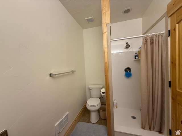 8043 E Badger Dr N, Heber City, UT 84032 - full bath featuring a stall shower, toilet, tile patterned flooring, and baseboards