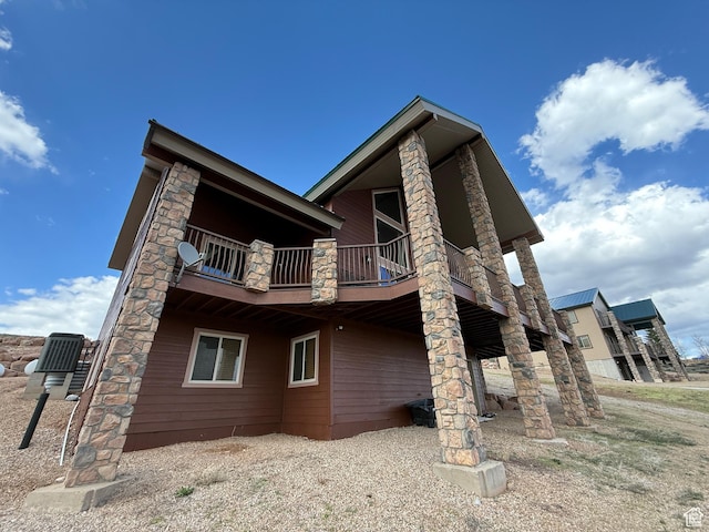 8043 E Badger Dr N, Heber City, UT 84032 - rear view of property featuring a balcony and central AC unit