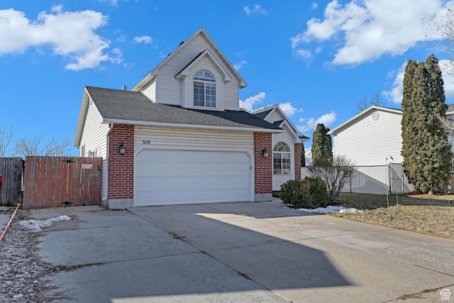 518 W 1330 N, Logan, UT 84341 - traditional-style house featuring driveway, brick siding, and fence