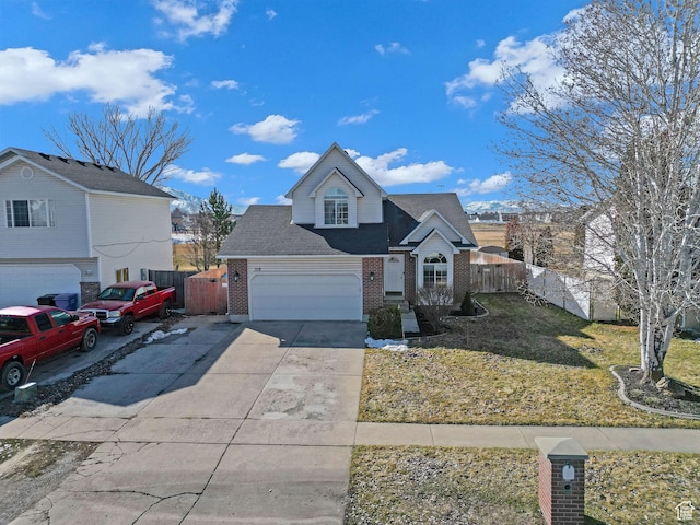 518 W 1330 N, Logan, UT 84341 - traditional-style home with brick siding, driveway, a garage, and a shingled roof